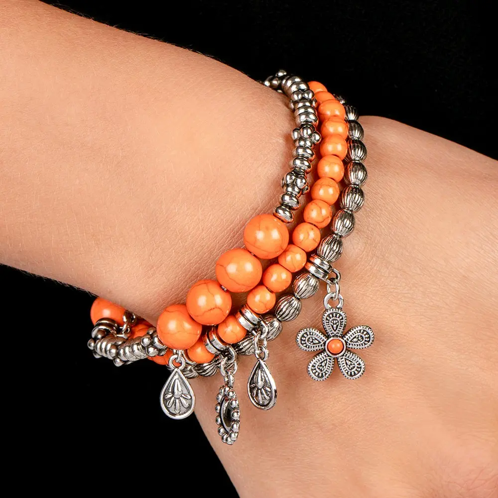 Individual Inflorescence Stretchy Bracelet - Strand of Linearly-Textured Silver Beads with Floral Charms, Orange Stones, and Textured Silver Accents