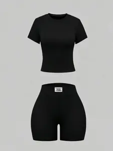 Women's summer solid color knit two-piece set, featuring a round neck short-sleeved cropped T-shirt and high-waisted cycling shorts, a casual and slim-fitting loungewear set suitable for everyday street wear Outfit