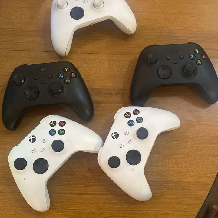 Xbox controllers and one Xbox Elite controller  Console