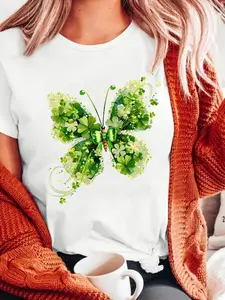 The Green Butterfly St. Patrick's Day Valentine's Day T-Shirt with a casual crew neck short sleeves, is sleek and breathable, and is embellished with a shiny clover butterfly motif for all seasons, making it an ideal gift for St. Patrick's Day.