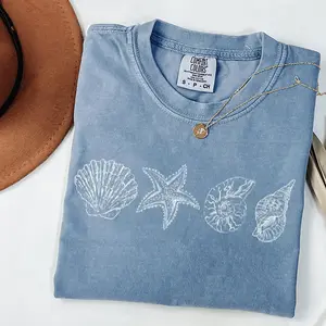 Comfort Colors sea shell T-shirt, perfect beach and summer tee for ocean lovers, featuring a cute sea-inspired design, ideal gift for women who love coastal style and nature