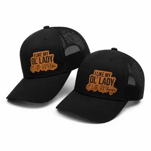 “I Like My Ol’ Lady A Little Bit Young” & “Older” matching trucker hats with premium leather patch detail, breathable mesh back, and adjustable comfort fit.