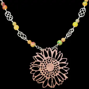 dyed quartz wire wrapped necklace with sunflower cutout charm