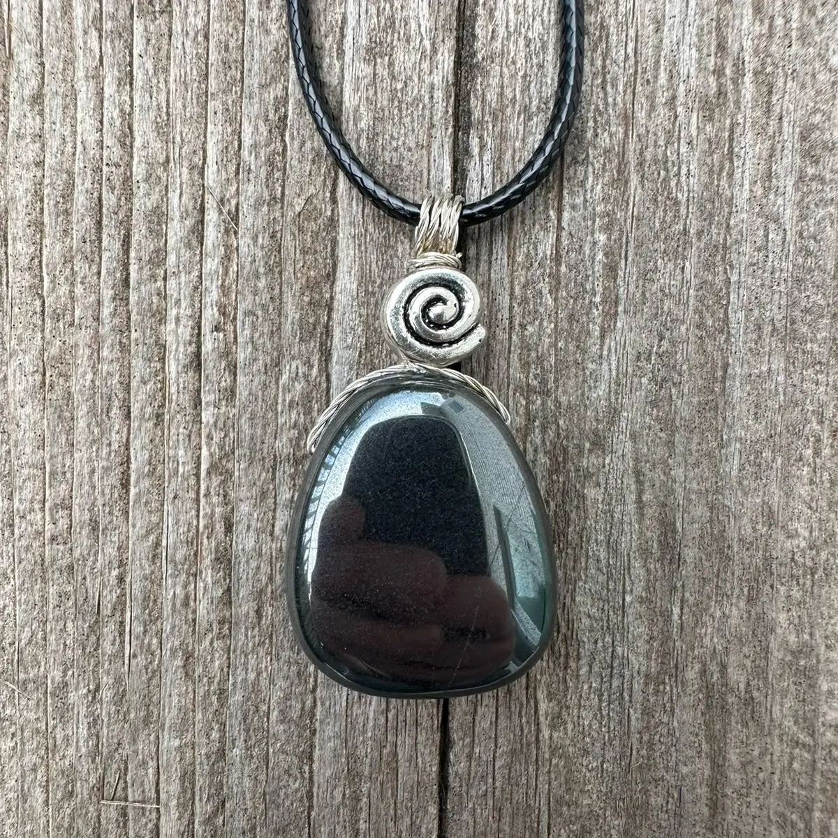 Hematite Necklace for Grounding, Root Chakra Connection, and Willpower. swirl Signifies Consciousness.