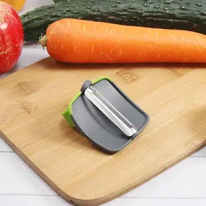 Palm Vegetable Peeler Kitchen Gadget Potato Peeler. Food Grade Silicone Grip