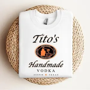 Sure, here's a revised title:  "Austin Texas Label Crewneck Sweatshirt by Tito's Handmade Vodka: Perfect Gift for Tito's Fans and Texan Enthusiasts"