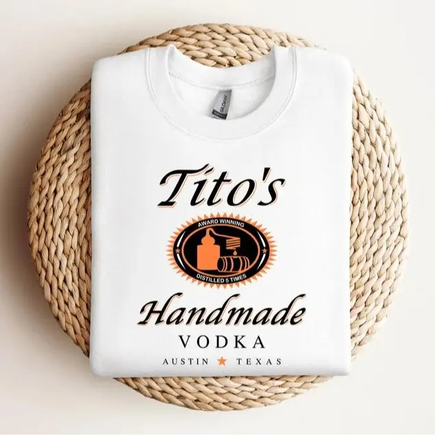 Sure, here's a revised title:  "Austin Texas Label Crewneck Sweatshirt by Tito's Handmade Vodka: Perfect Gift for Tito's Fans and Texan Enthusiasts"