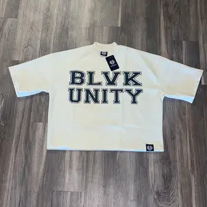 BlvkUnity Crème Mirror Statement Tee - Oversized Fit, Bold BLVK Unity Print, Comfortable Cotton Material