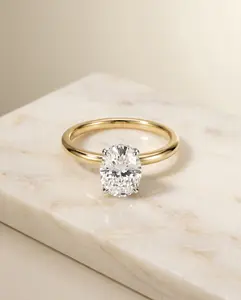 The Eartha Hidden Halo Engagement Ring Setting for Oval Diamonds in 18K Yellow Gold