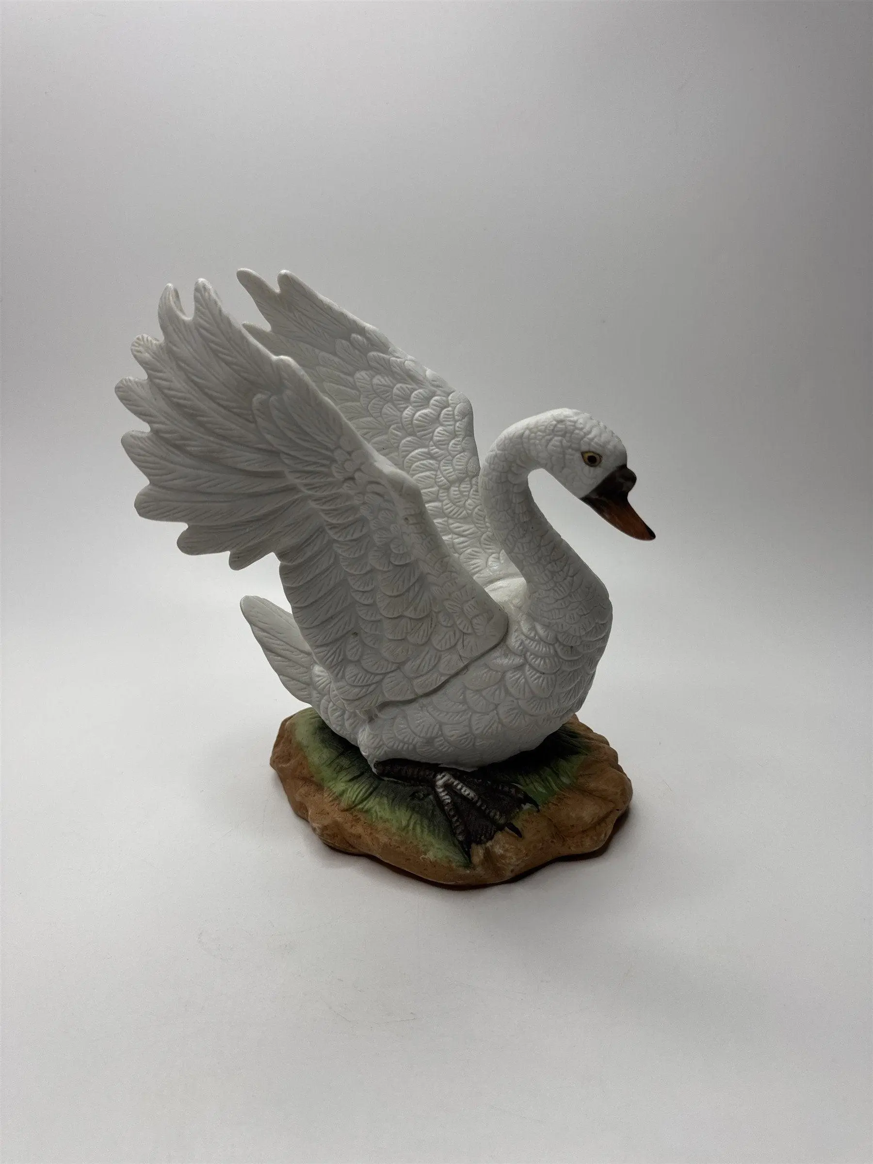 Vintage Porcelain Bisque Swan With Spread Wings Figurine Statue on Green Ground