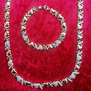 Gold XOXO Necklace & Bracelet Set with Decorative Elements and Elegant Design