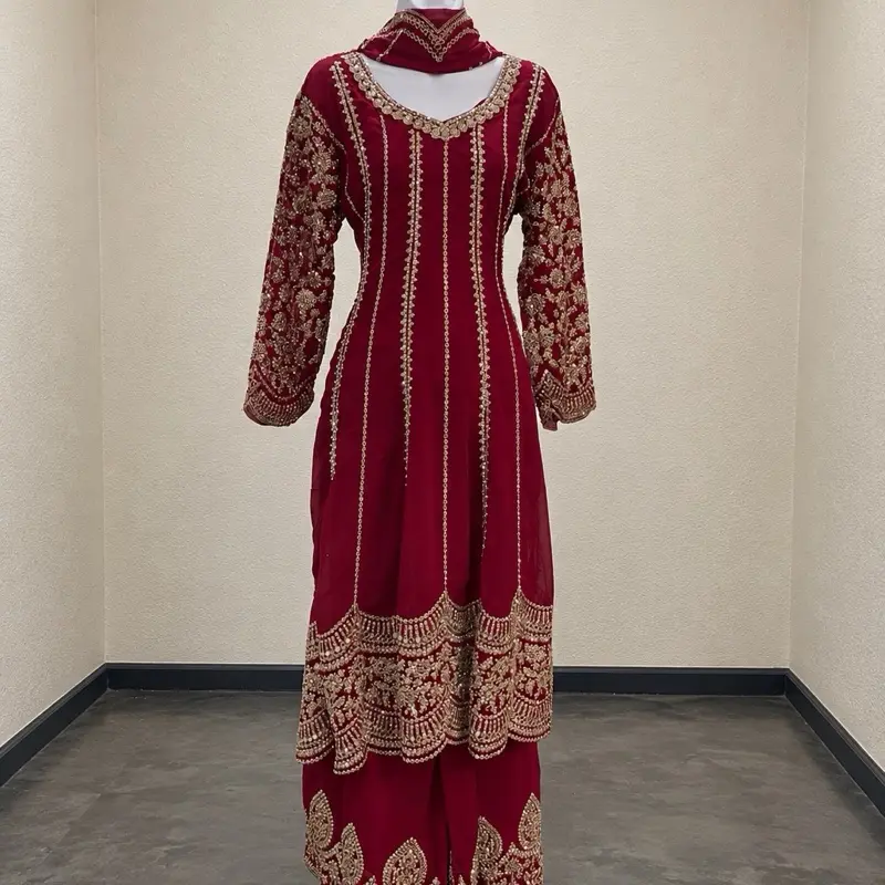 This elegant outfit is a 3-piece embroidered free size For 38 to 44 party wear suit, typically featuring a long kameez (top), matching pants or a sharara/palazzo, and a dupatta (scarf). Womenswear