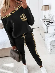 A 2-piece set of women's fashionable slanted shoulder collar leopard print long sleeved shirt and lace up pants, suitable for daily versatile occasions and home sports wear