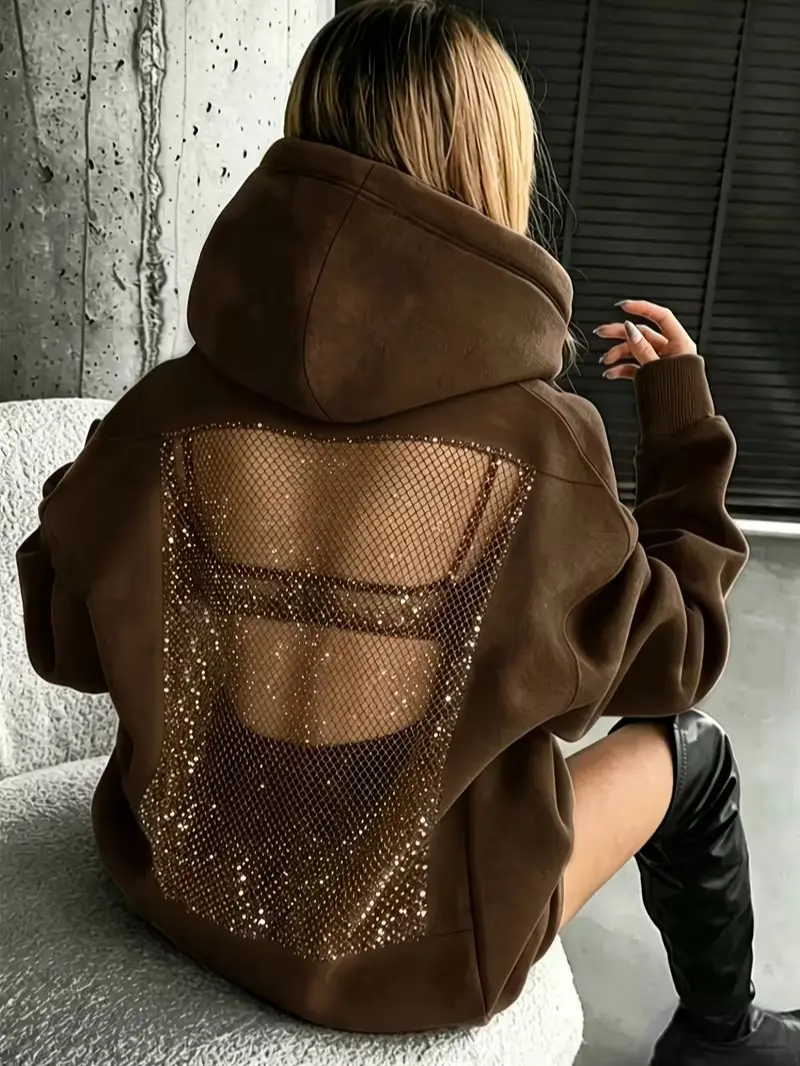 Women's hooded sweatshirt featuring a rhinestone-accented cutout back, a loose streetwear-style fit, and an edgy, fashionable design.