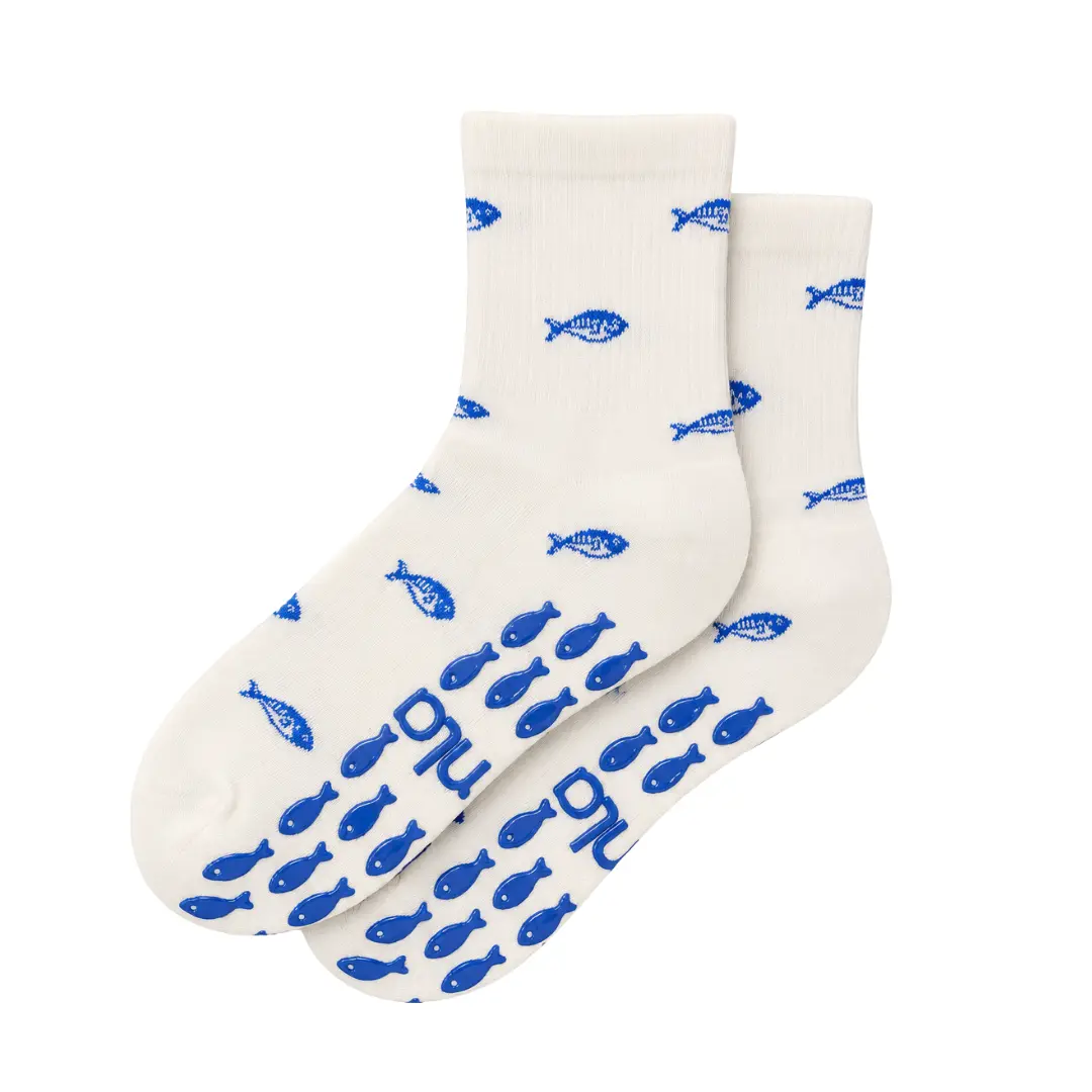 The Blue Fish Knit Grip Sock with fish-shaped grips for Pilates, Barre, Lagree, and Yoga