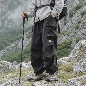 Unisex loose cargo parachute pants—lightweight, waterproof outdoor hiking long pants with a relaxed street-style fit, suitable for both men and women.
