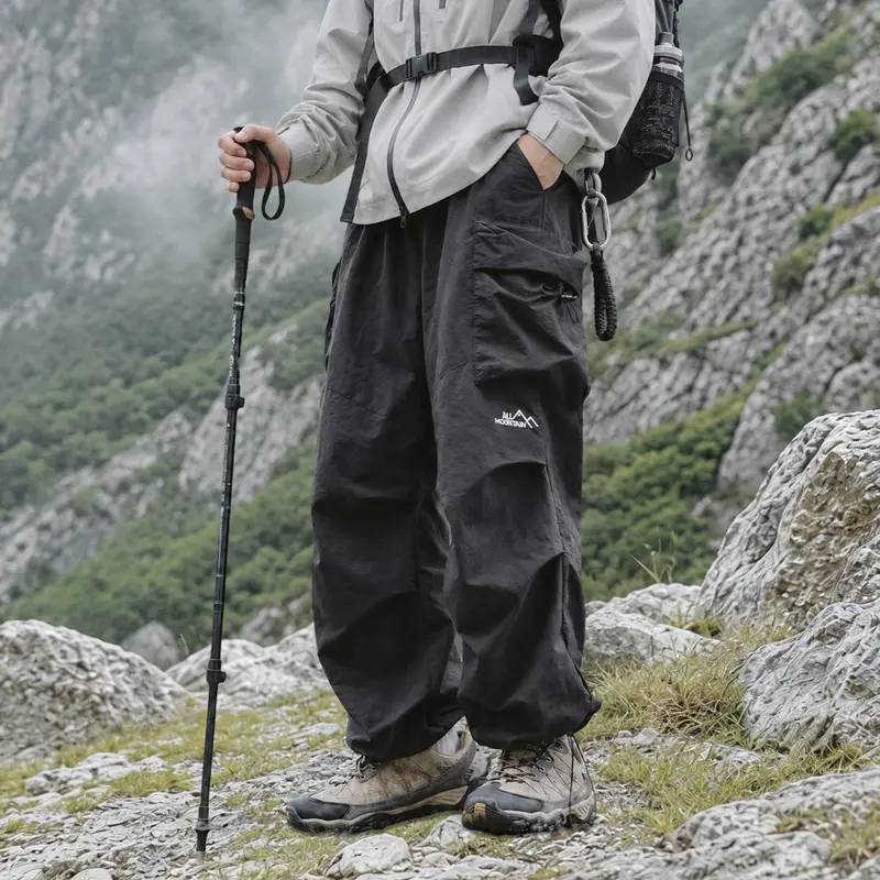 Unisex loose cargo parachute pants—lightweight, waterproof outdoor hiking long pants with a relaxed street-style fit, suitable for both men and women.