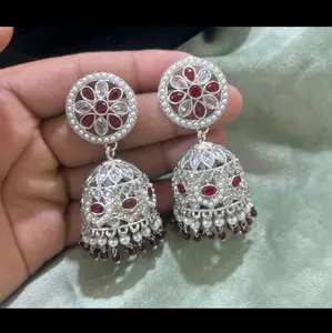 Silver jhumka in polki style and reverse AD.