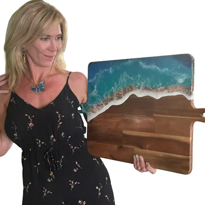 This handcrafted ocean wave cutting board is perfect for beach lovers! Made from durable wood with a stunning resin art design, it’s ideal as a charcuterie board, serving tray, or housewarming gift.