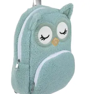Send your child off to school with a cute and functional accessory like this Turquoise Owl Backpack. This adorable, fuzzy backpack boasts a delightful design of a turquoise-colored owl with a glittery gold-colored beak. Open the zipper at the top