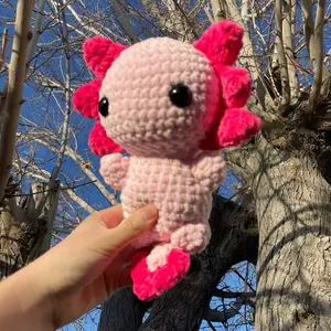 Pink axolotl crochet plush