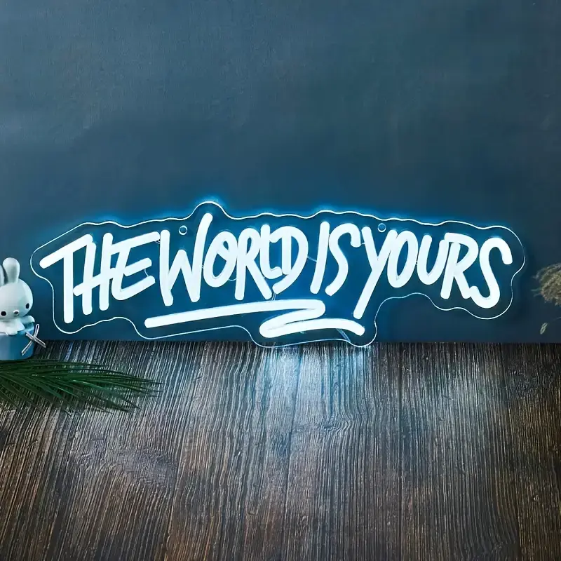 "The World Is Yours LED Neon Sign - Cool White Plastic Light with Blue Background, Durable LED Strips, Modern Novelty Lighting, Light-Up Novelty Lighting for Room Decor"
