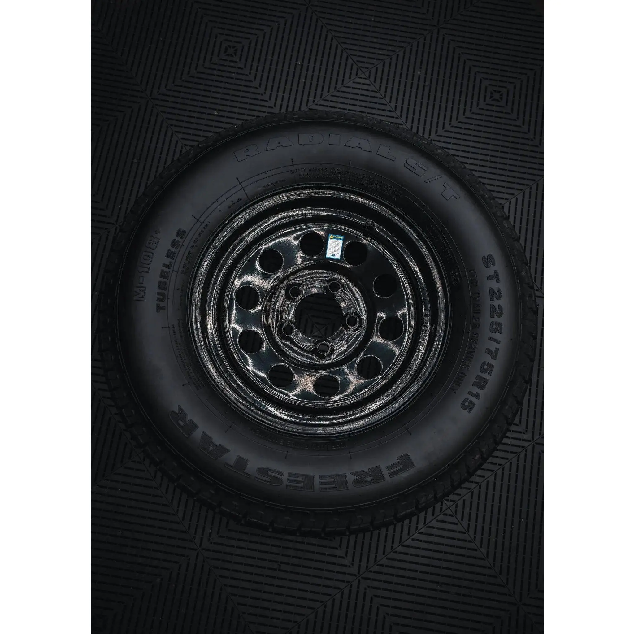 225/75R15 10-Ply Trailer Tire on 15" 5-4.5 Black Modular Wheel