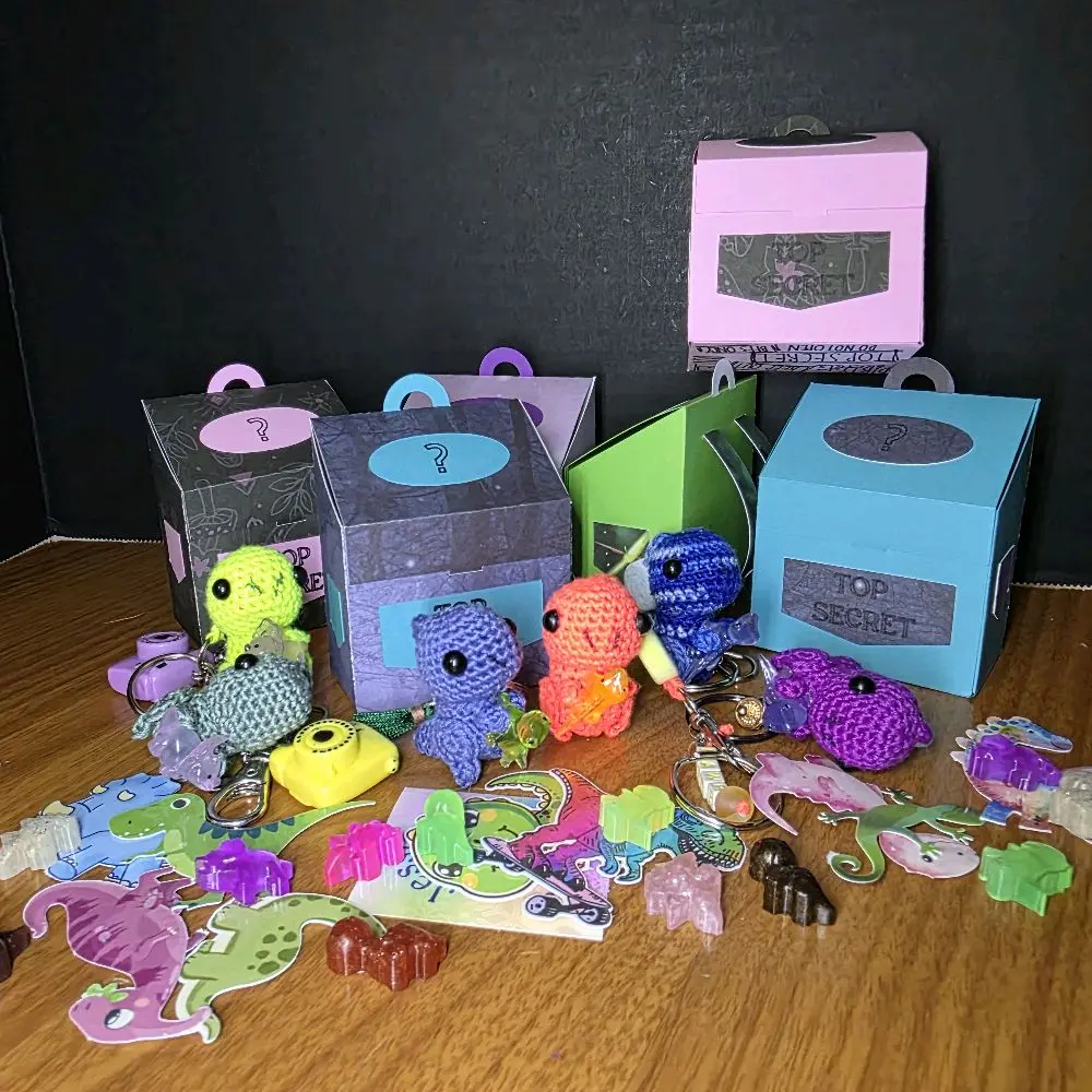 Crochet Tiny Dino Keychain Holding Lizards or a Dino with Handmade Stickers & Resin Poured Dinos in Cute Little Box
