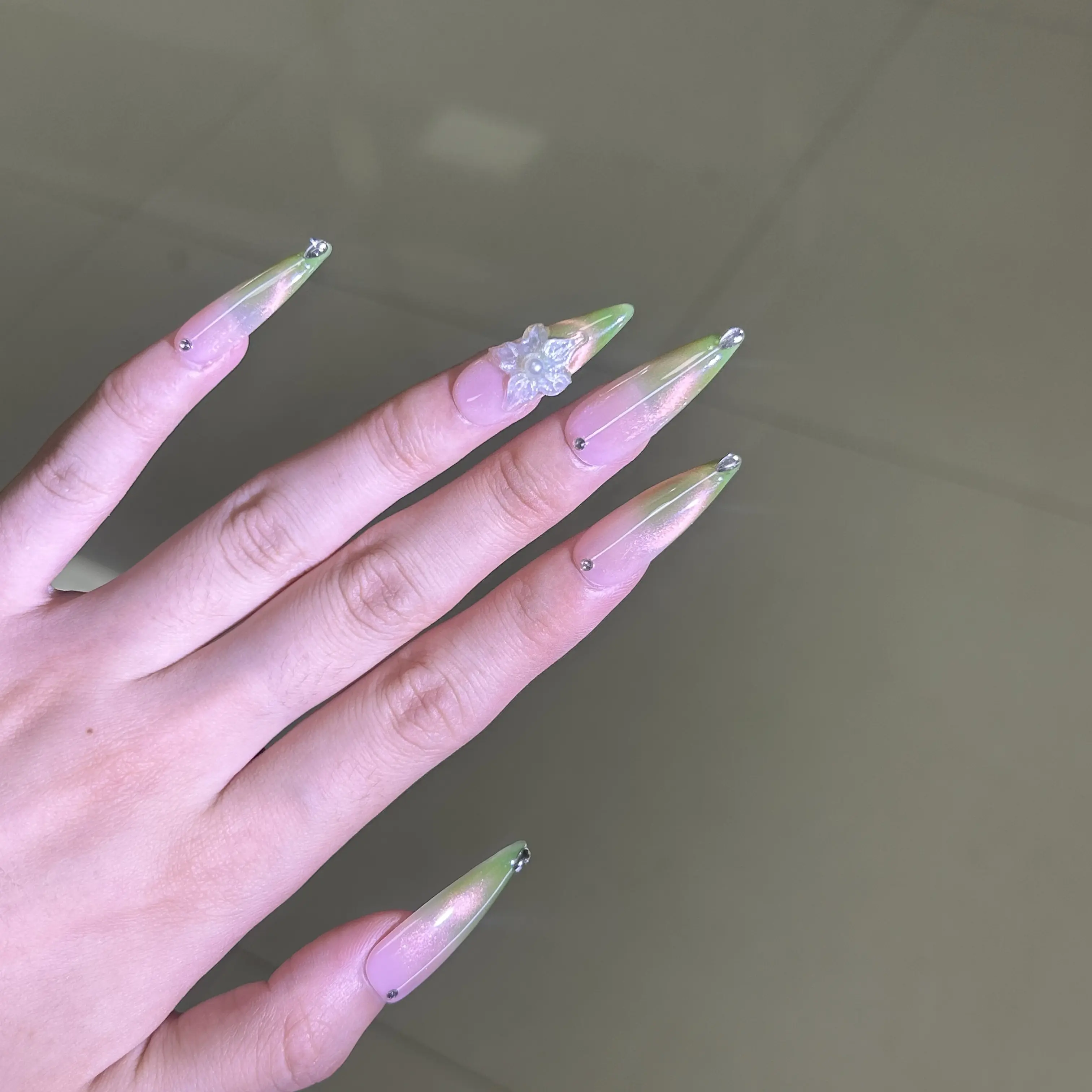 Handcrafted wearable press-on nails with a green powder gradient and butterfly design, fresh 3D butterfly long ballet nail tips, sweet yet cool vibe, handcrafted wearable nails