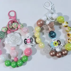 Wristlet Keychain with Beaded Bar Silicone Focal Bead and 15 mm Silicone Beads for Stylish Accessory Featuring Floral and Butterfly Designs