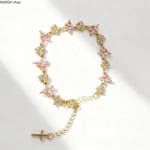 The "Golden Butterfly" Bracelet—adorned with black crystal butterflies, paired with a gold-plated chain and a cross pendant. Whether for everyday wear or for attending parties, weddings, and anniversary celebrations, it is the perfect choice for you