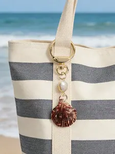 A seashell pearl keychain, beach bag charm, summer beach style bag accessory, coastal keychain, natural seashell keychain, fashion accessory, suitable for bags
