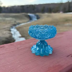 Elegant Blue Tealight Candle Holder with Decorative Base and Unique Design