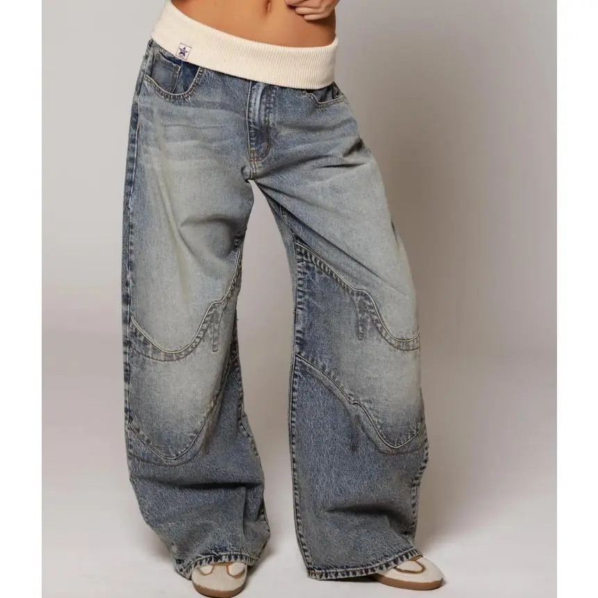 Retro street style, figure-flattering, high-waisted, washed blue denim jeans for women.