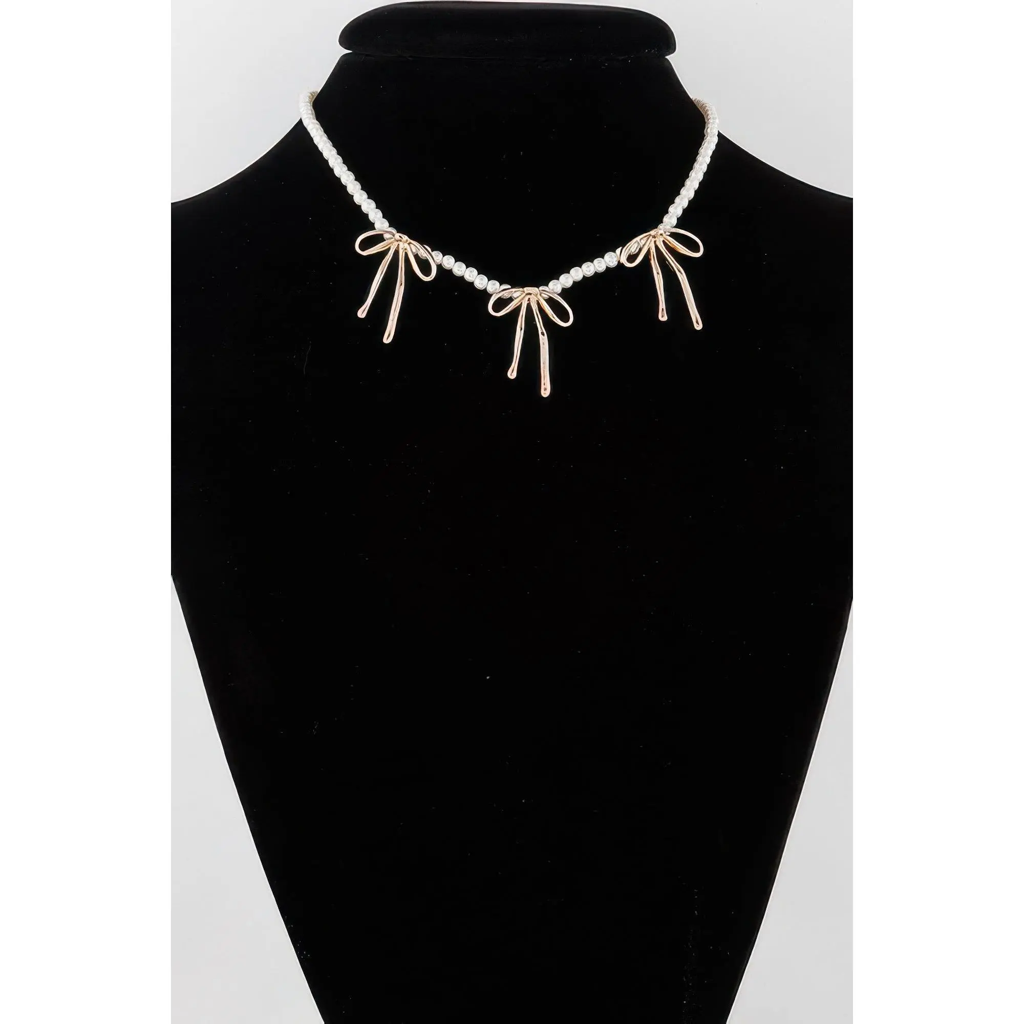 Pearl And Metal Ribbon Charm Necklace