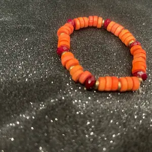 Orange and Red Beaded Bracelet with Gold Accents for Stylish Accessory