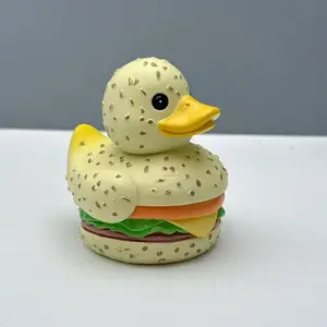 Curious Burger Duck Ornament - Cute resin tabletop decoration with expressive expressions and sesame-like spots. Ideal for indoor and outdoor fantasy home gardening decoration. No electricity required. A playful gift for burger lovers.