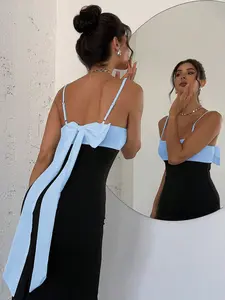 A spaghetti strap dress with a large color-block bow at the back and a side slit, Pure, sensual, feminine, Lady style, known as the 'birthday dress' and 'date atmosphere dress', suitable for banquets, parties, casual social events and other occasions