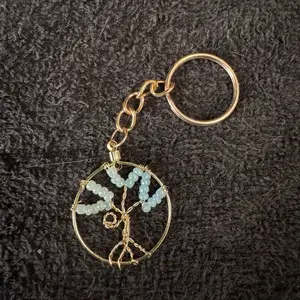 Handcrafted Tree of Life Keychain with Light Blue Beads and Gold Wire Design for Unique Gift