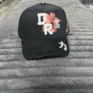 Dreamer Kanji Anniversary Black Baseball Cap with Floral Design and White Lettering