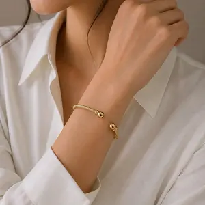 Elegant Gold Tone Bangle Bracelet with Delicate Bead Detailing for Women's Fashion Accessory