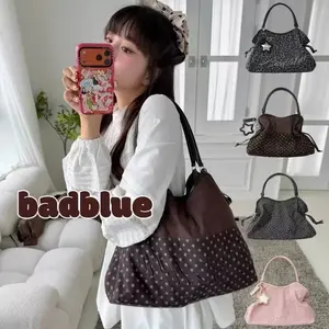 BadBlue, a Korean brand known for its niche, forest-inspired leopard print dot pattern, business-ready bag with a trendy, sweet-