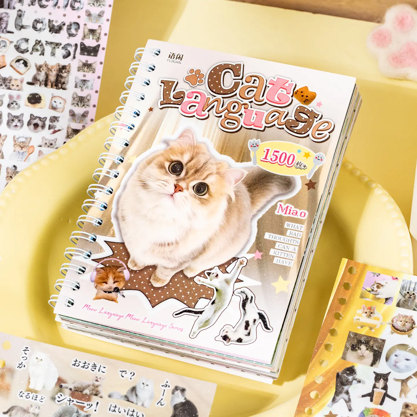 Cat Language Sticker Book, spiral bound, with 1500 stickers across 30 pages. It features 3 surface finishes: glossy, glitter and skin-touch texture. Ideal for kitten lovers to DIY and decorate journals, tablets, refrigerators, skateboards and more.