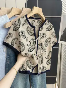 Women's khaki bohemian vacation ethnic short-sleeve knit top. Loose round neck, contrast patchwork paisley print, front tie design, contrast piping. Comfortable for spring & summer casual wear.