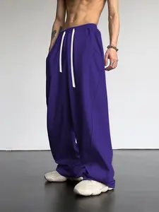 One piece men’s jogger sweatpants with color blocking, drawstring, and 3D cutting; casual urban relaxed style. Soft knit fabric drapes comfortably; loose wide-leg fit that flatters the legs. Suitable for urban men for everyday commuting, leisure walks, an