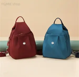 Includes shipping fee. Attractive new multi-layer nylon fabric backpack/shoulder bag for women—versatile Korean-style fashion, casual, lightweight.