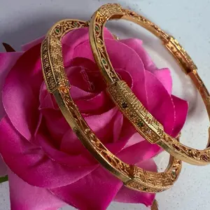 Bangles - Gold-Colored Decorative Bangle with Elegant Design and Sparkling Accents
