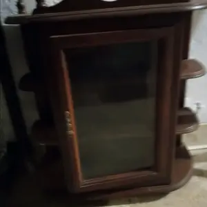 wood curio caninet with glass door