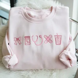 Embroidered Coquette Pink Nurse Icon Sweatshirt, Healthcare Shirt, CNA Sweatshirt, Medical Assistant, Nursing Grad Gift, Coquette Nursing Sweater