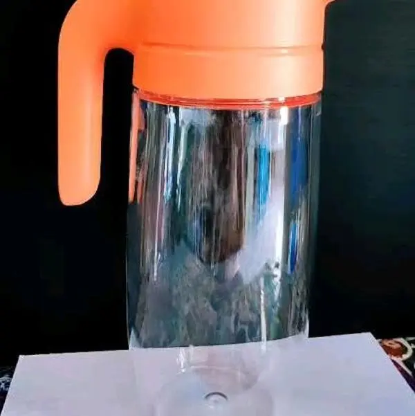 Tupperware Clearly Elegant Tritan Beverage Pitcher 1.7L with Strainer Lid for Kids & Adults - Durable, Lightweight, Mess-Free Pouring, Crystal Clear Drinkware for Fruit Infusions & Ice Cubes